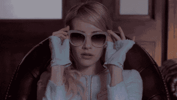 Emma Roberts takes off her sunglasses in Scream Queens
