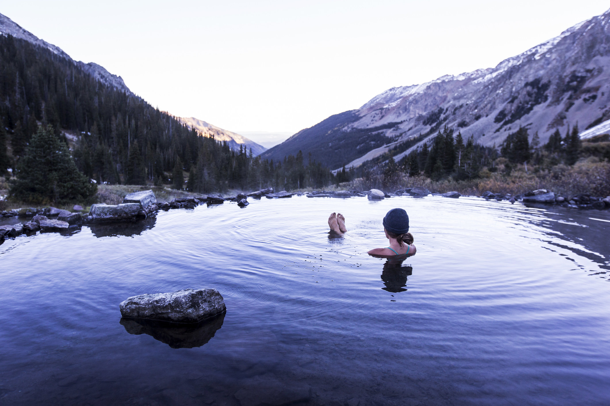 A woman soaking in hot springs.