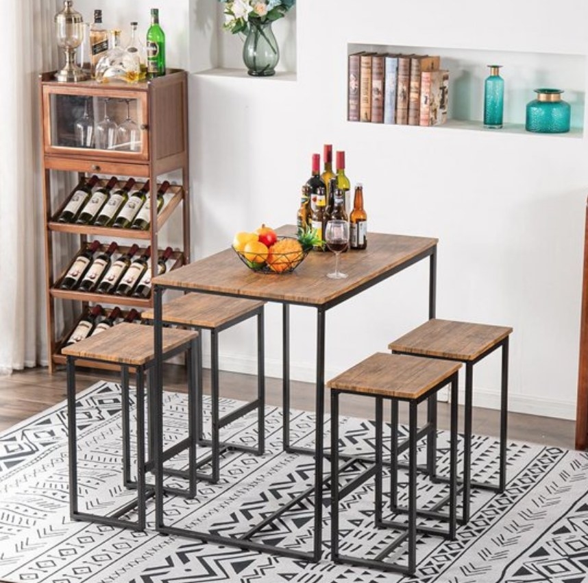 A walnut/metal dining set with 4 stools and a table
