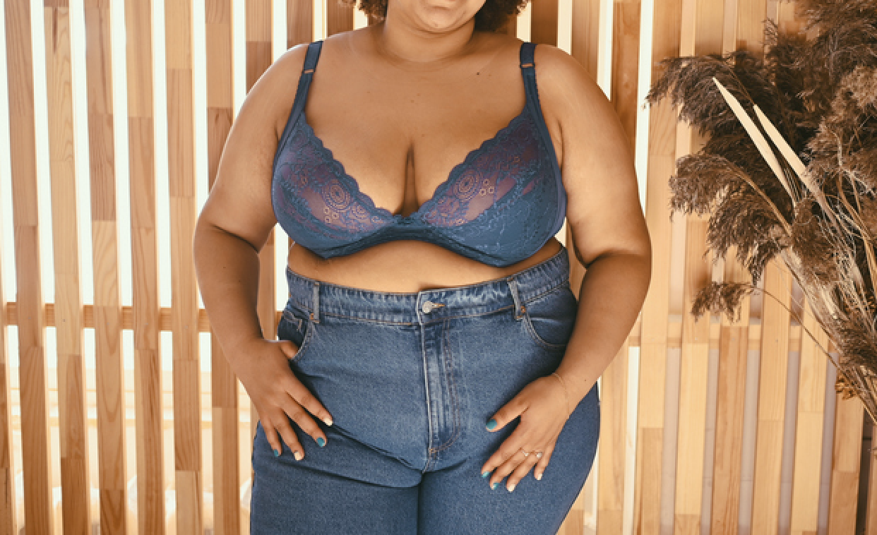Woman wearing a bra and jeans