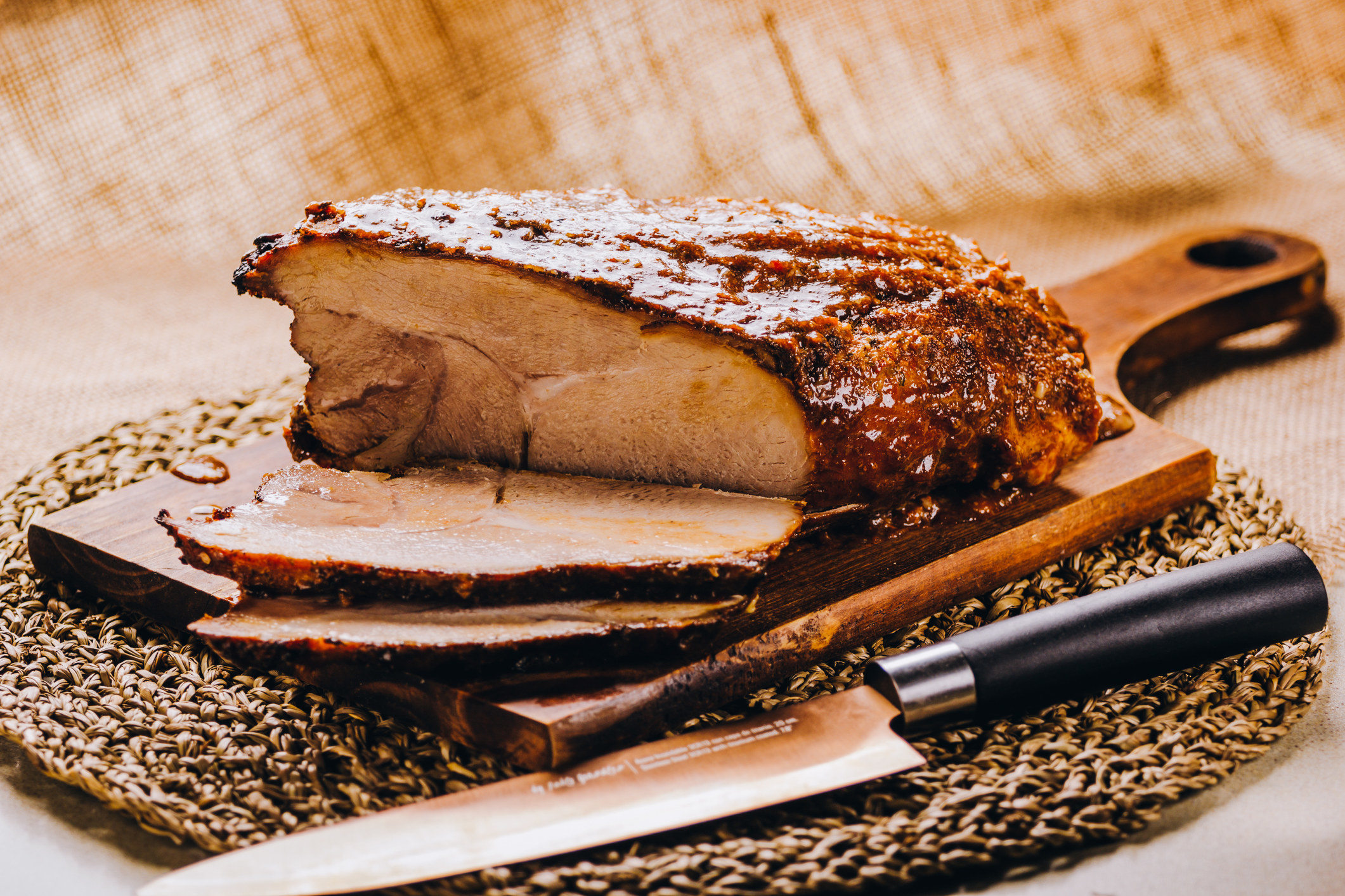 Slow-roasted pernil on a cutting board.