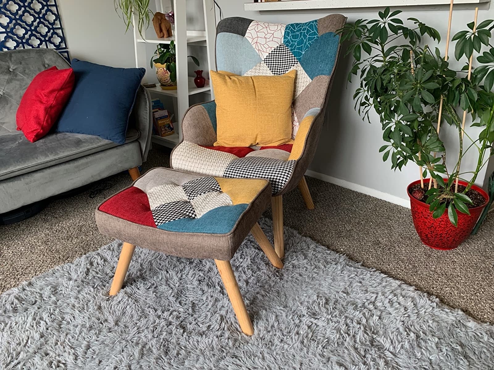 Reviewer&#x27;s colorful patchwork chair and ottoman is shown