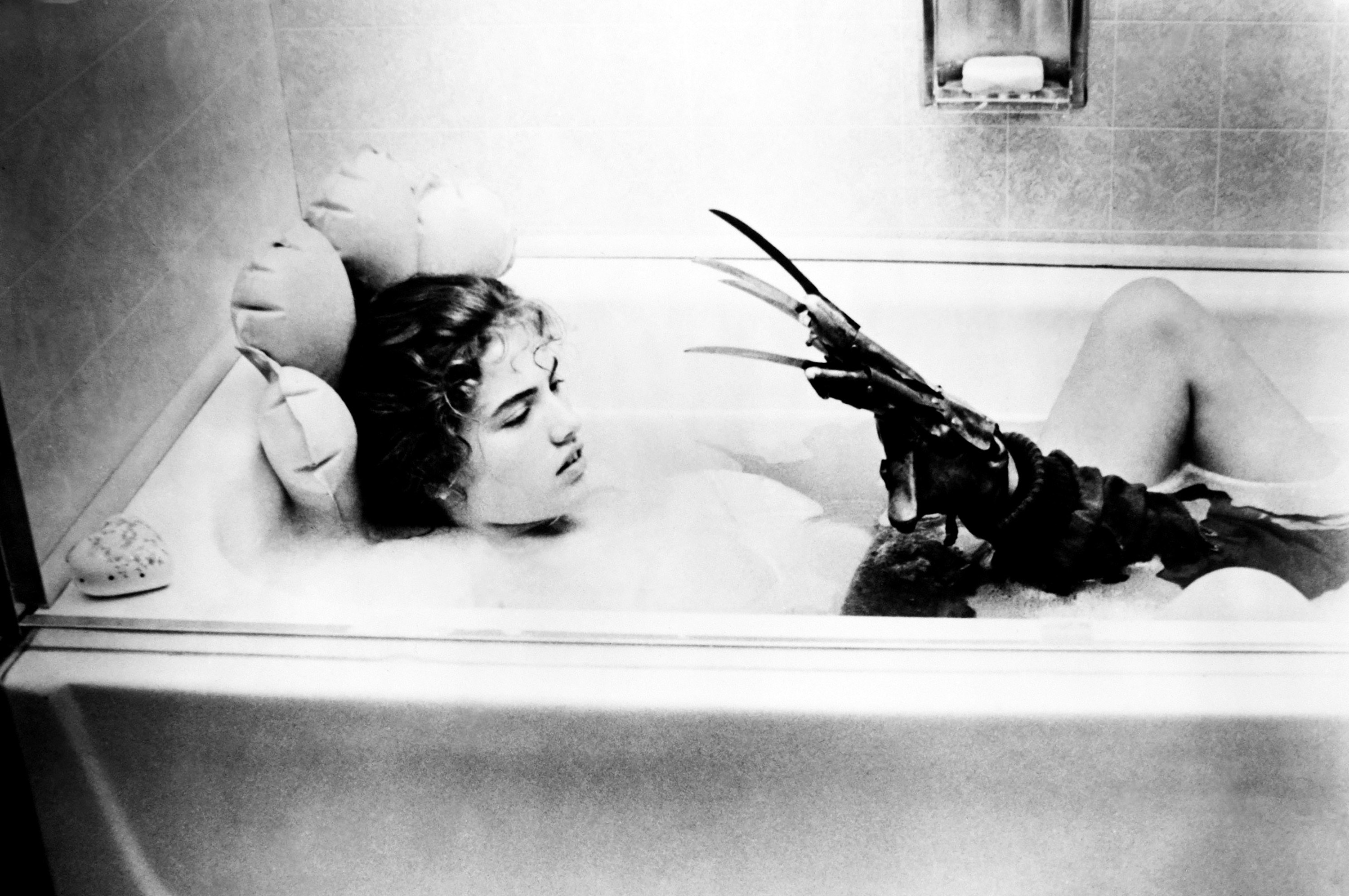 Freddy Krueger attempts to kill a girl who fell asleep in the bath