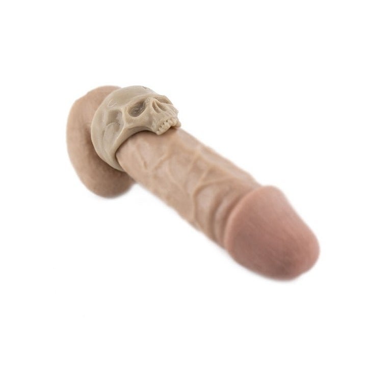 Cock ring demonstrated on dildo