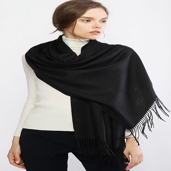 Model wearing scarf as a shawl