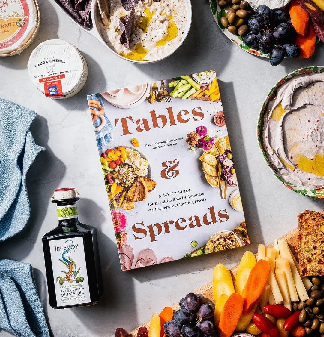 The book on a counter surrounded by ingredients