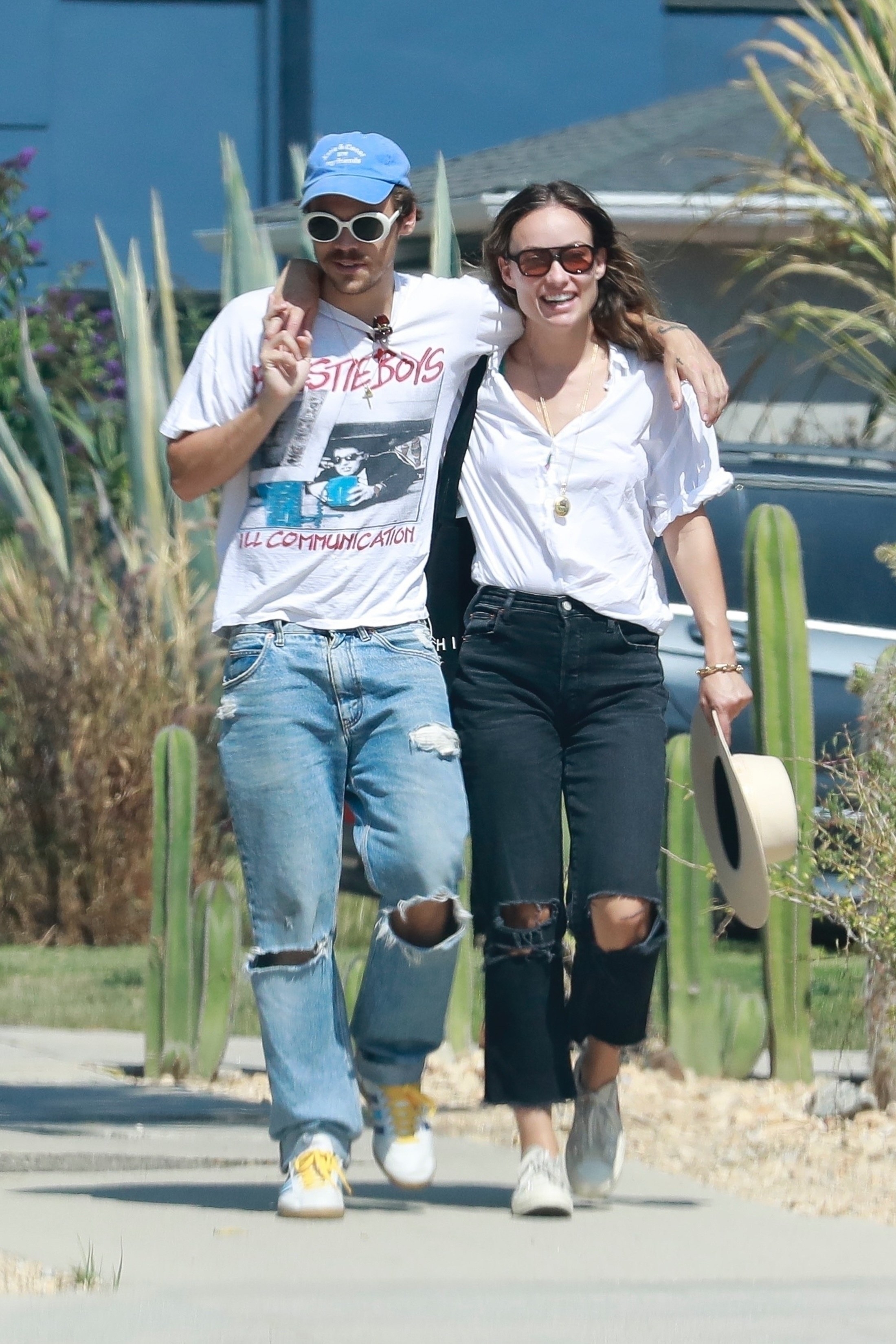 Harry Styles and Olivia Wilde walking arm in arm