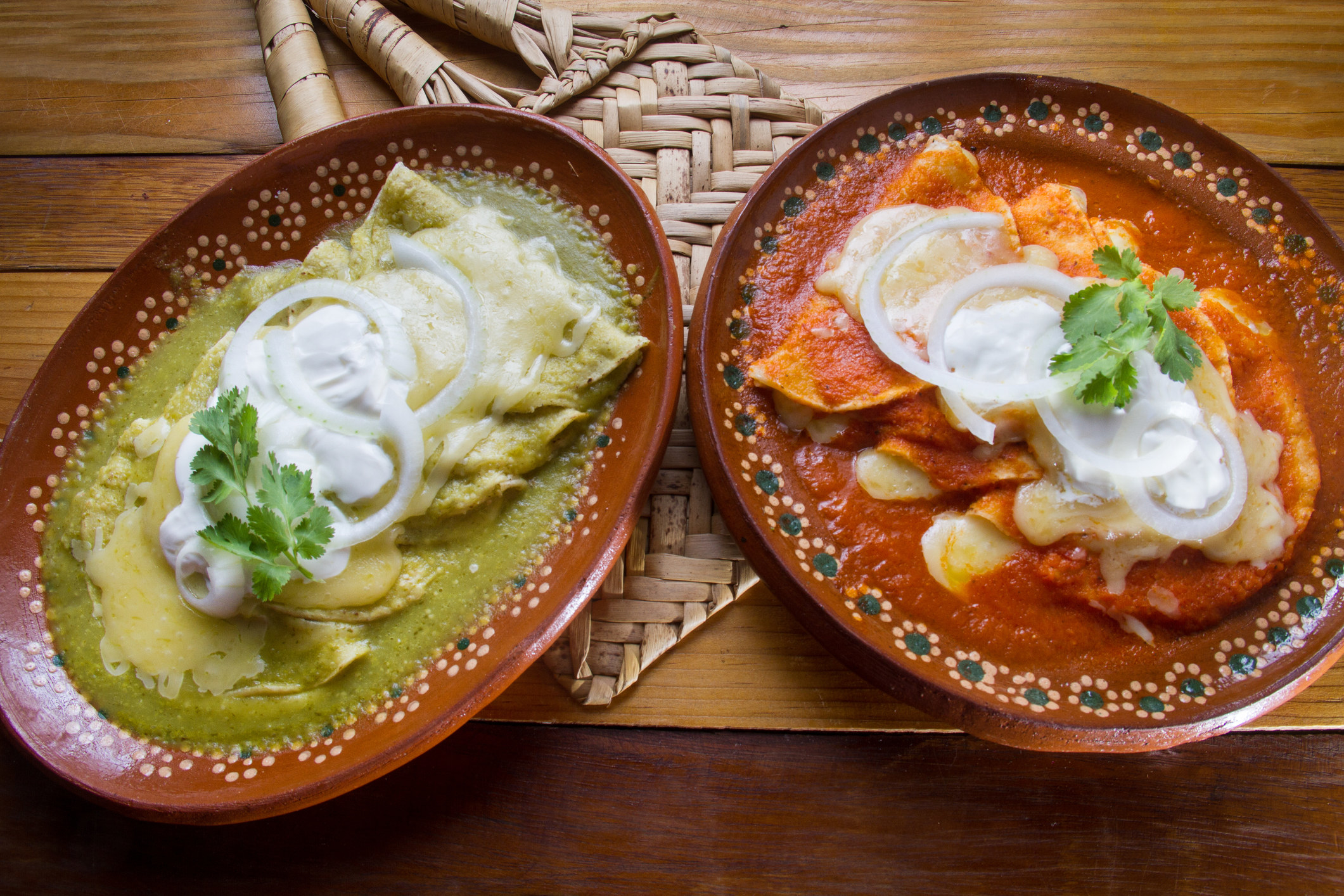 Two platters of enchiladas.