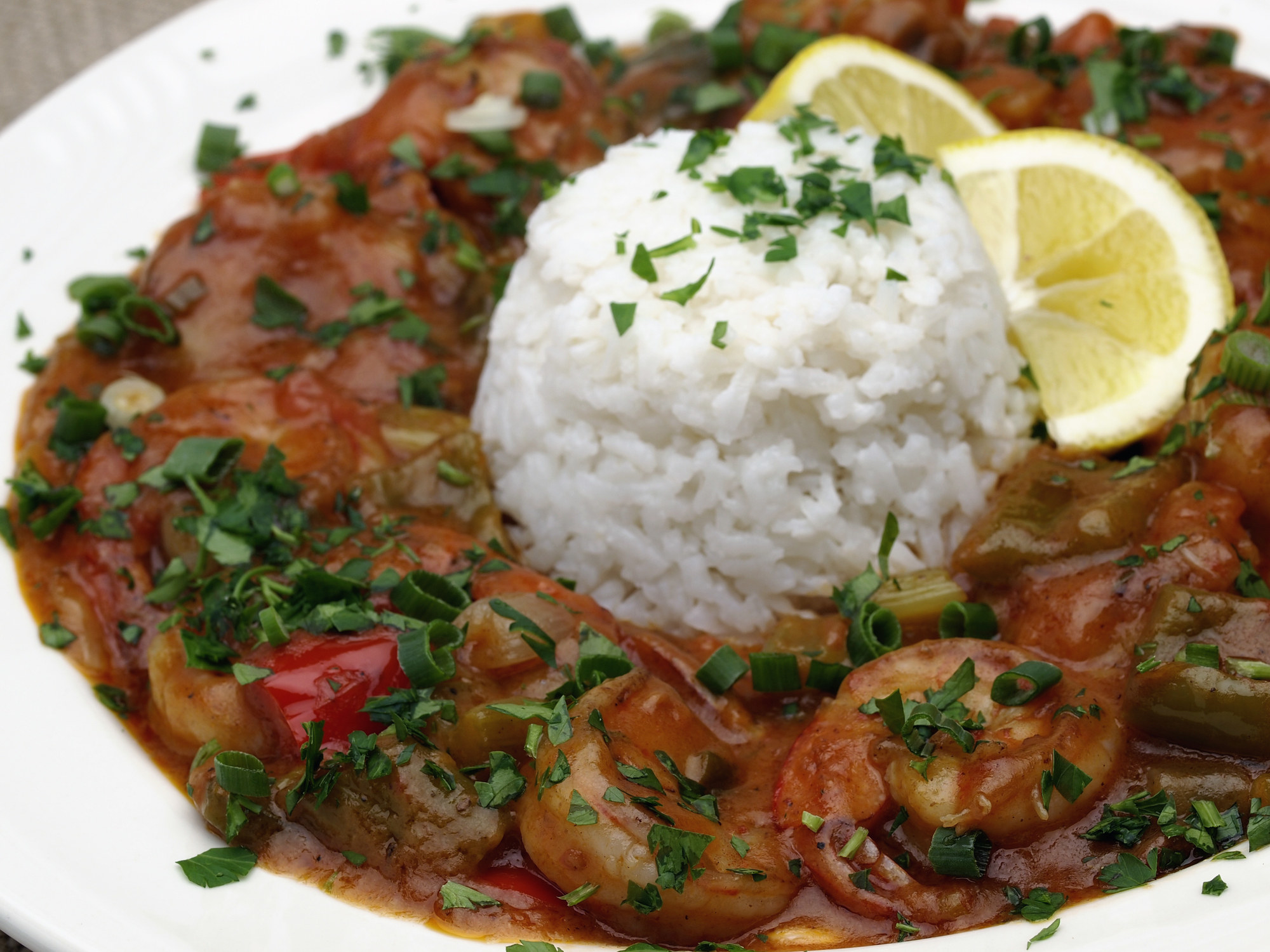 A dish of enchilado de camarones with rice.