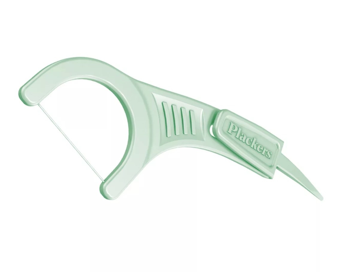 A mint green small flosser with a pick end that says &quot;Plackers&quot;