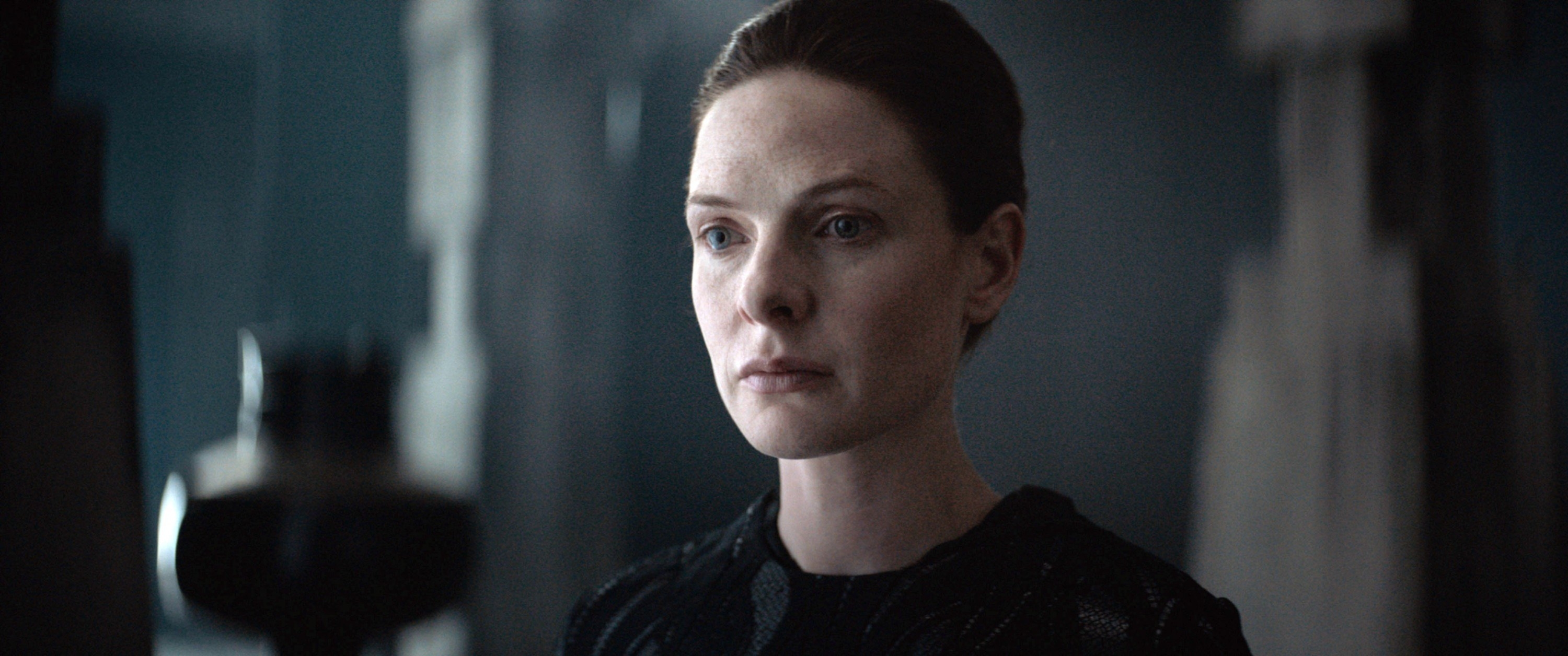Jessica (Rebecca Ferguson) looking scared, standing in an old fortress