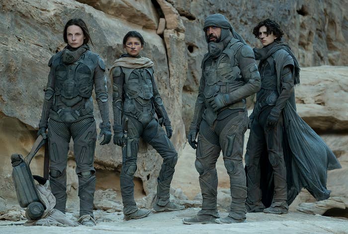 Members of the cast of &quot;Dune&quot; standing by rocks
