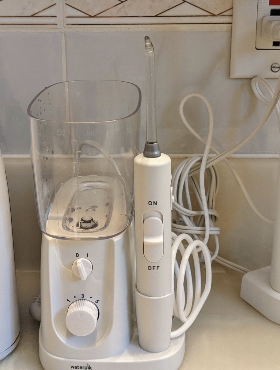 a corded waterpik waterflosser on a counter