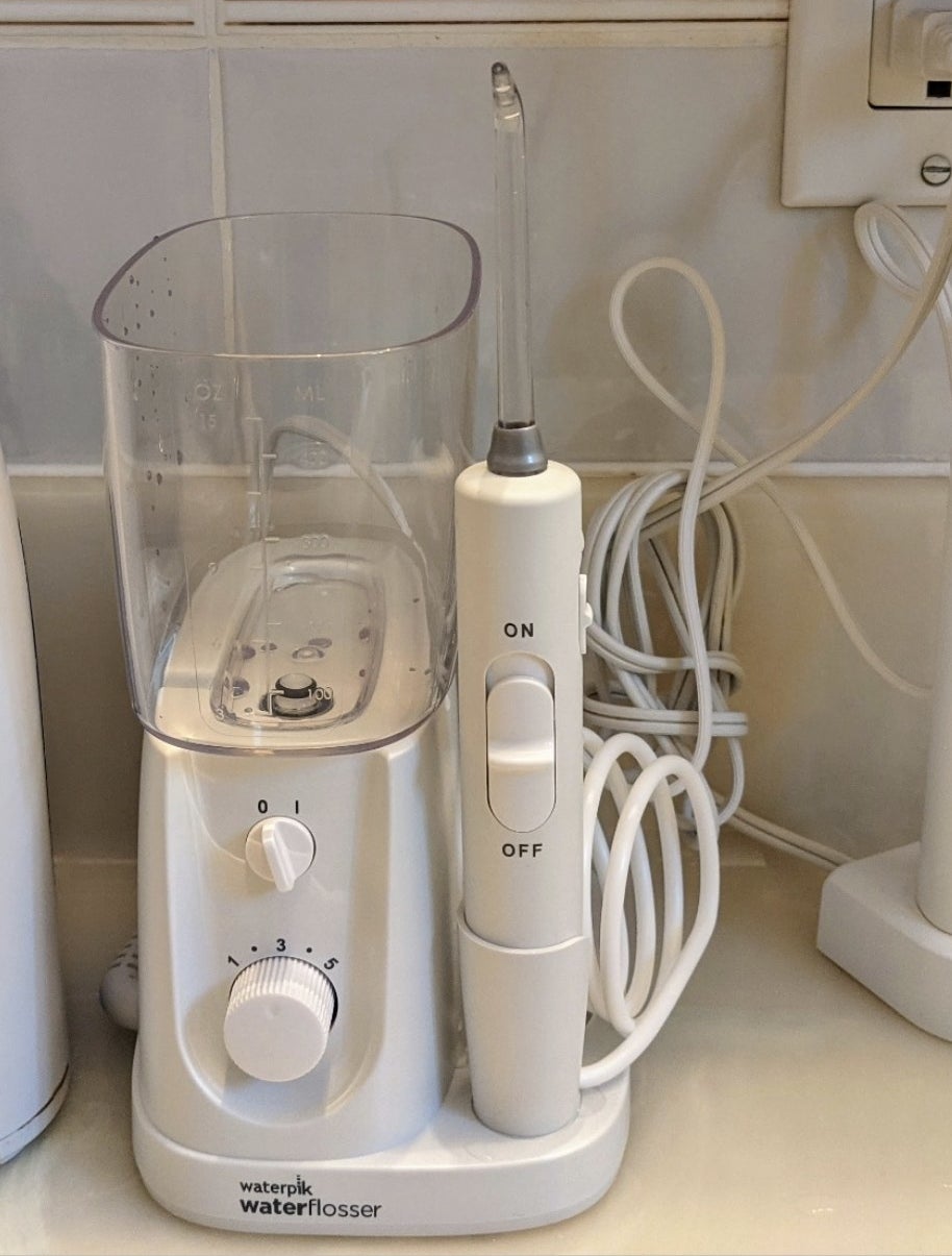 a corded waterpik waterflosser on a counter