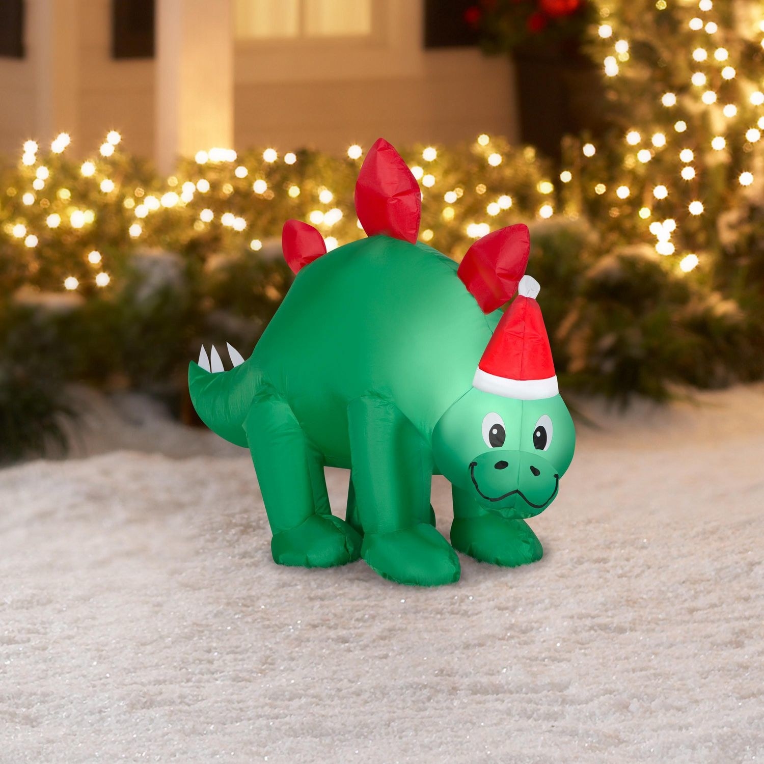 the stegosaurus with a Santa hat on