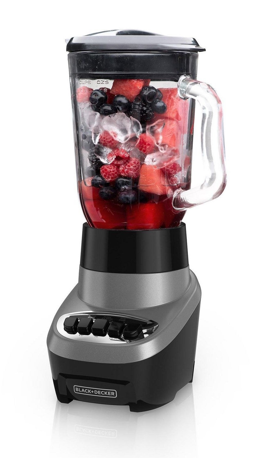 the blender with fruit and ice in it