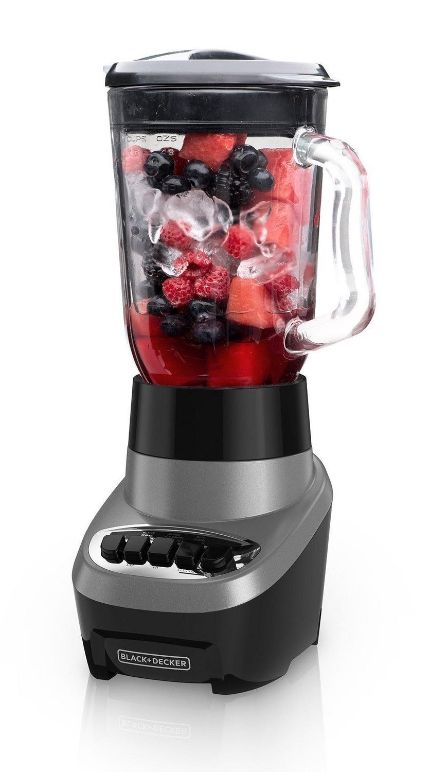 the blender with fruit and ice in it