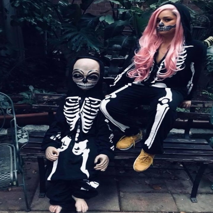 the skeleton onesie worn by two reviewers