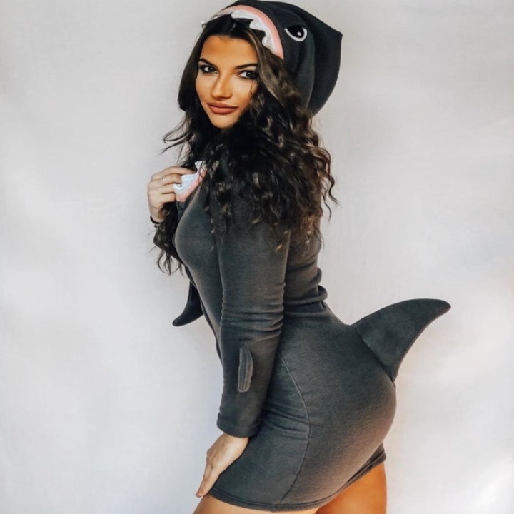 a reviewer wearing the shark costume