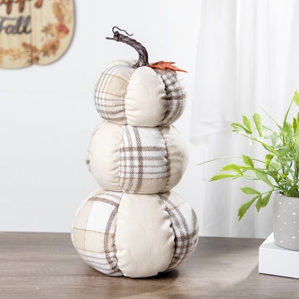The stacked fabric pumpkins.