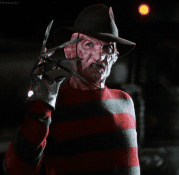 Freddy Krueger shows off his bladed glove on his hand