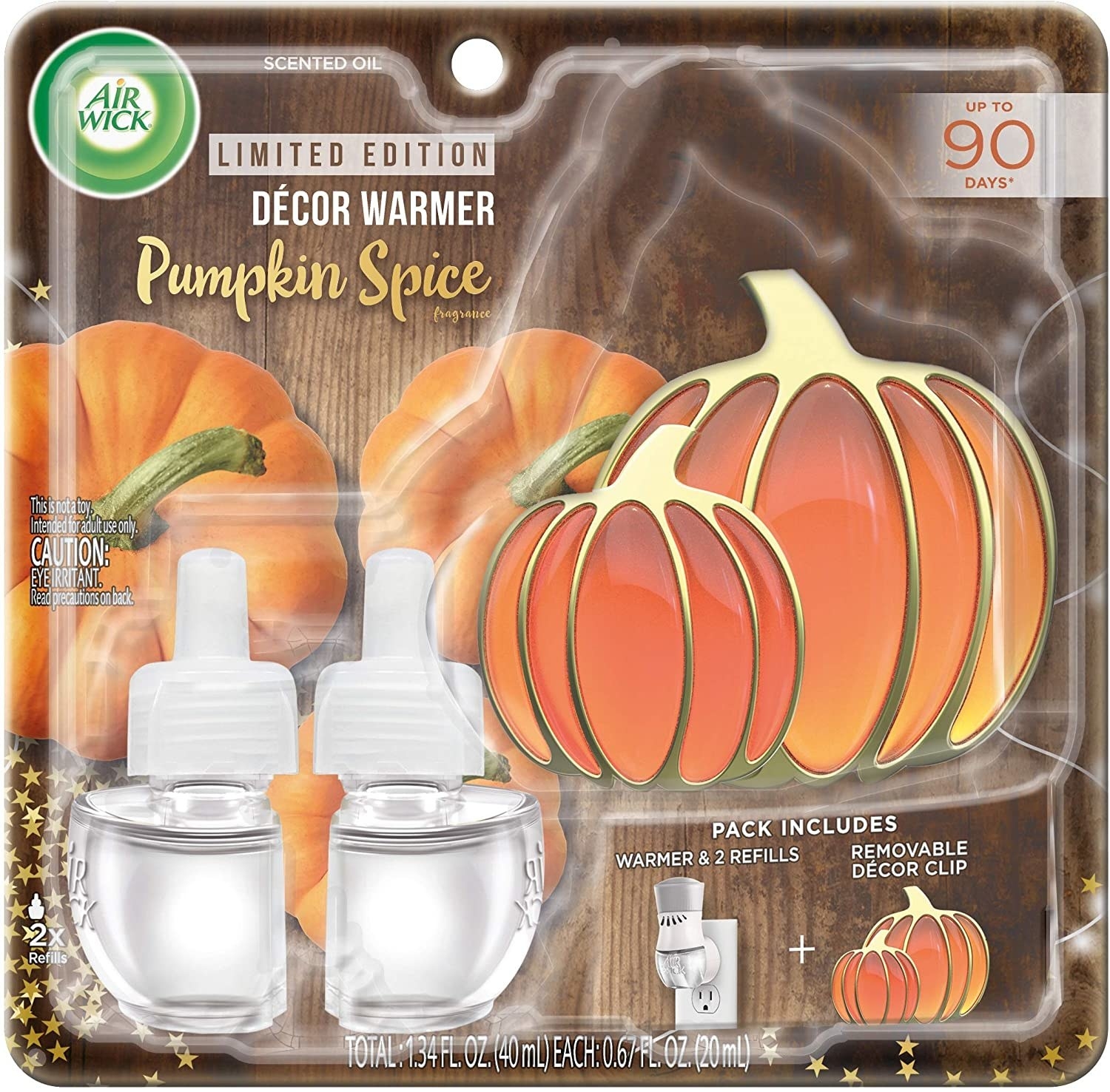 The contents of the pumpkin-shaped decor warmer set in packaging