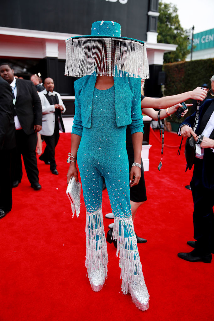 a wide-brimmed hat with crystals hanging from it