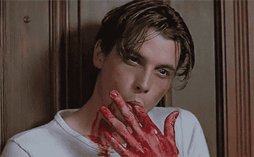 Skeet Ulrich as Billy Loomis licking blood off of his finger