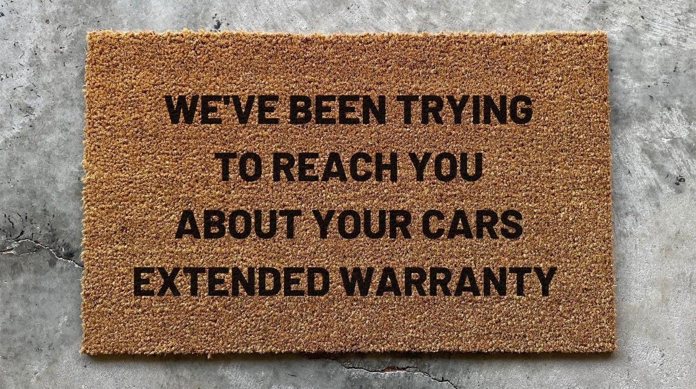 The doormat that reads We&#x27;ve Been Trying to Reach You About Your Cars Extended Warranty