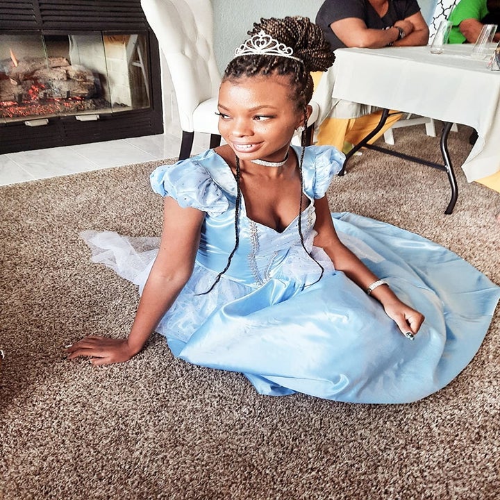 a reviewer sitting on the floor in the gown