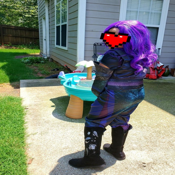 a reviewer's child wearing the costume