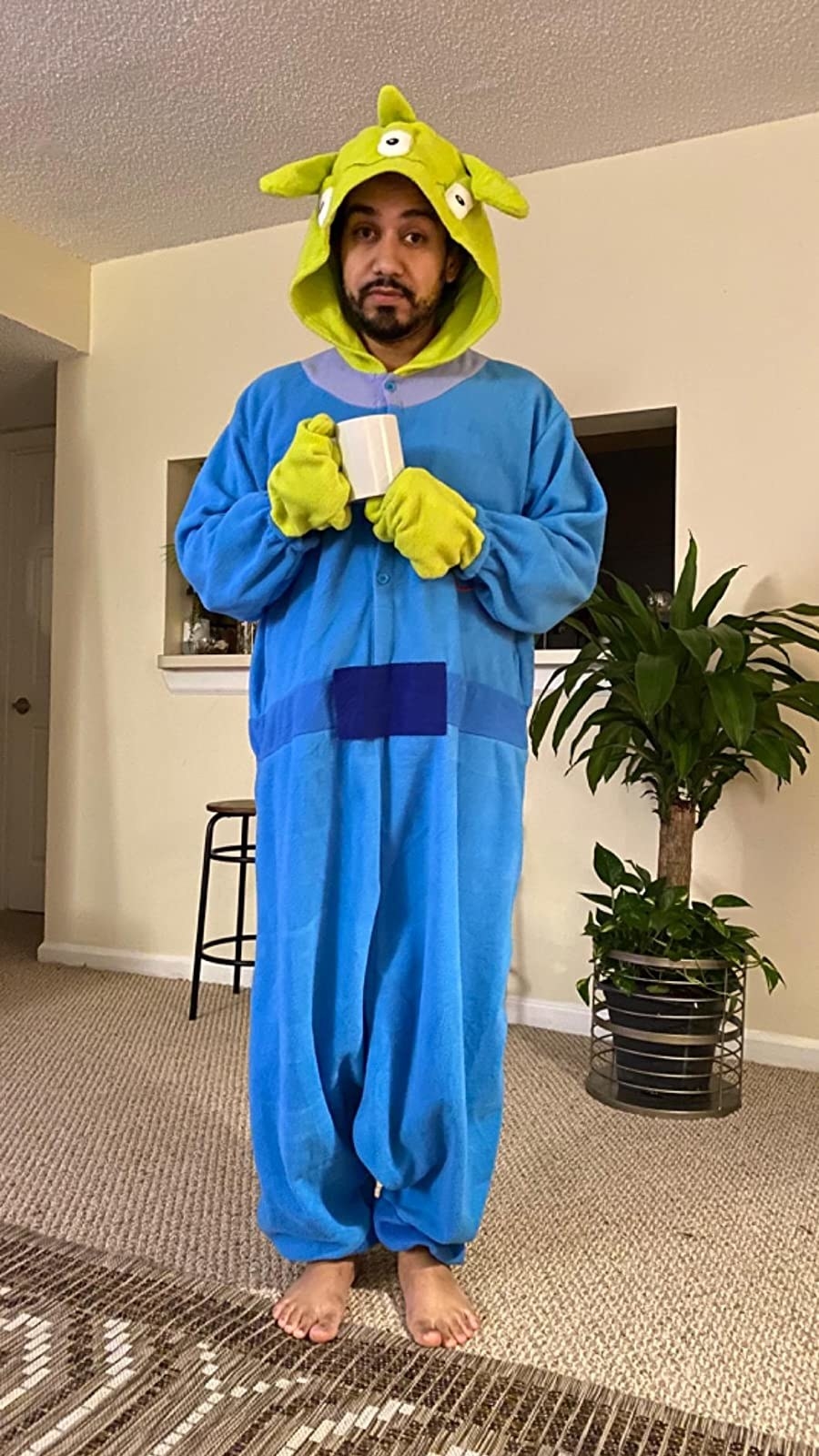 a reviewer in the toy story alien onesie