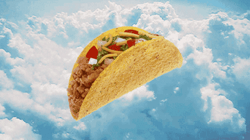 A taco floating in a blue sky with clouds