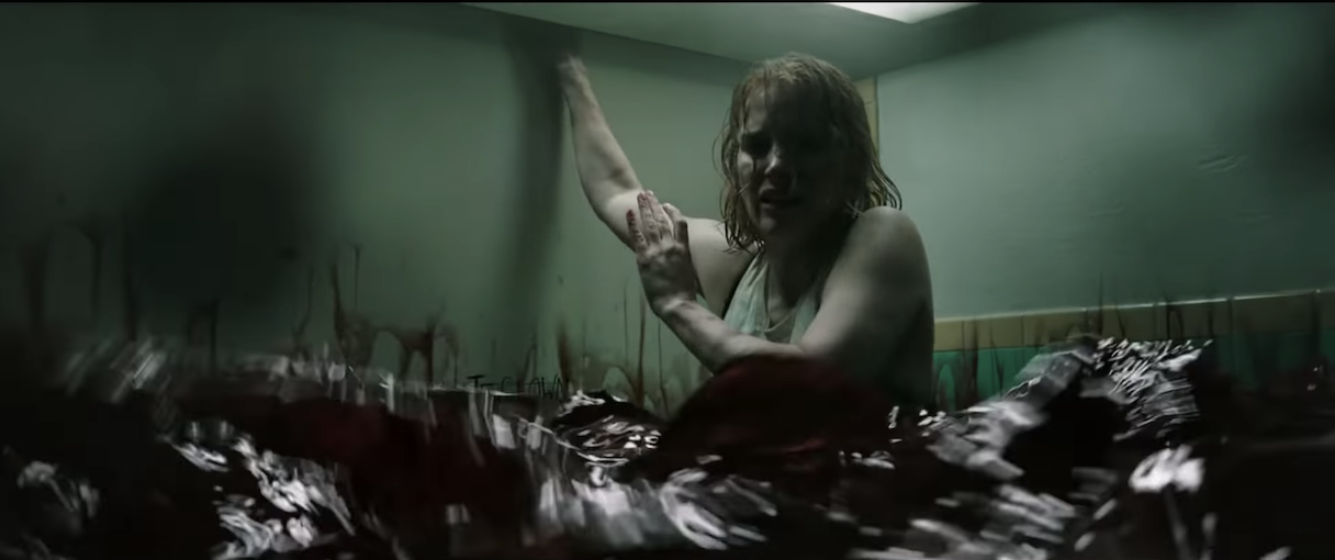 Jessica Chastain as Beverly in a room being filled with blood