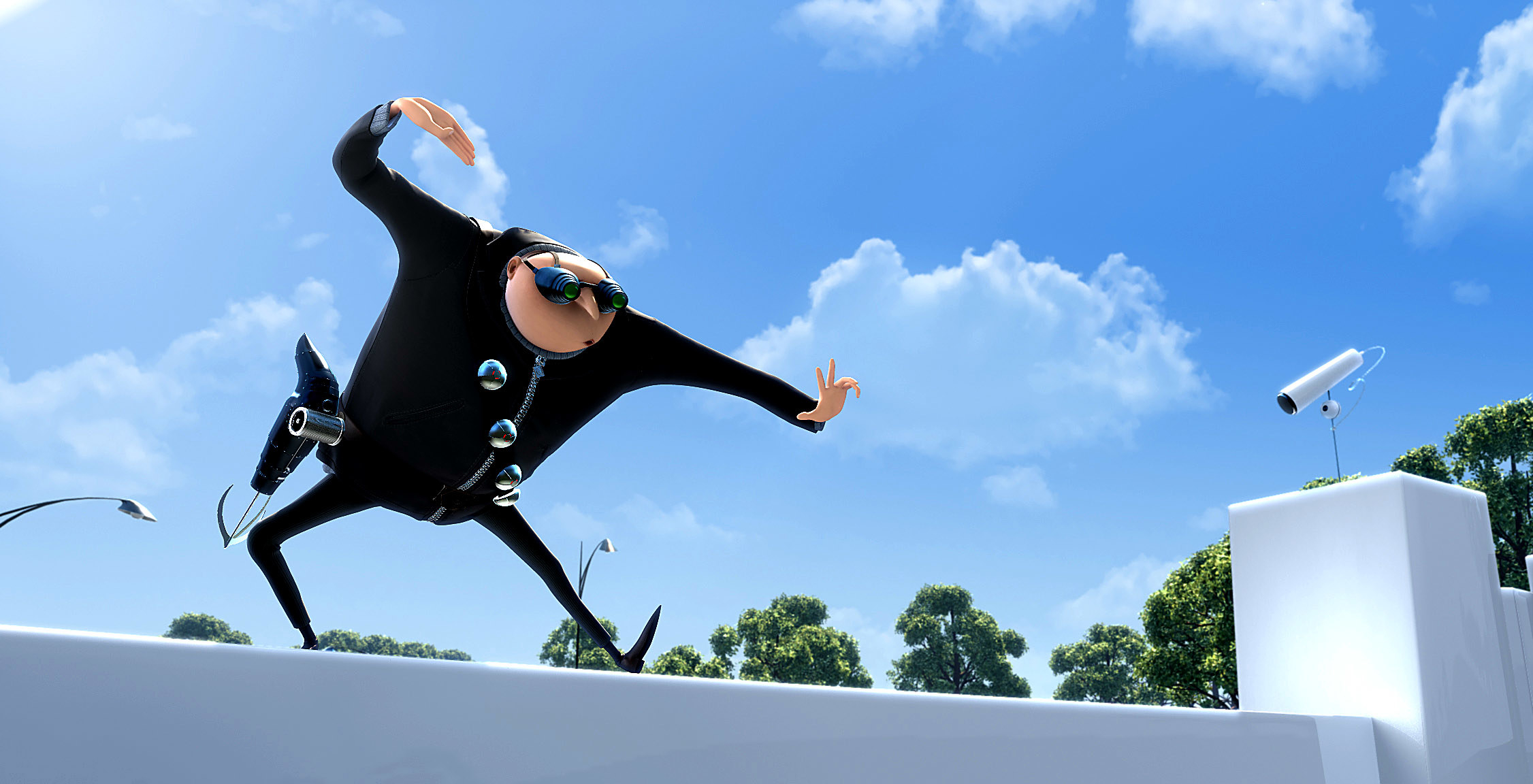 Gru in a ninja pose on top of a security wall