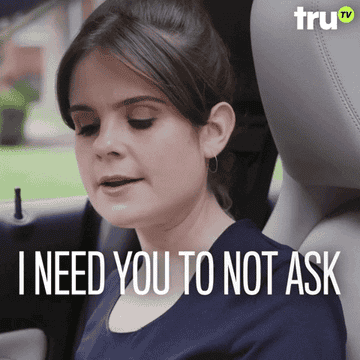 Woman in a car saying, &quot;I need you to not ask too many questions&quot;