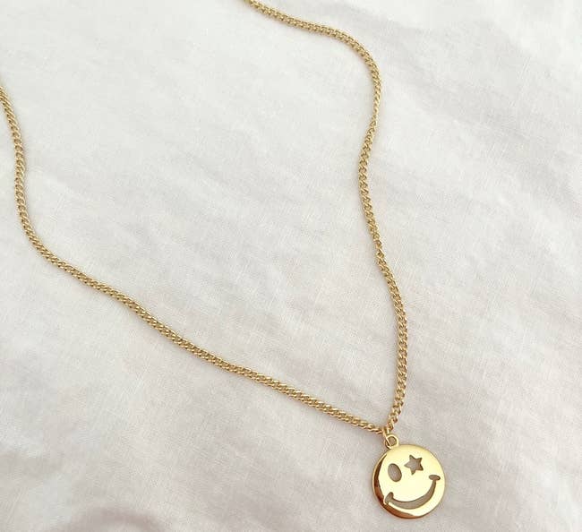 the gold star smiley necklace