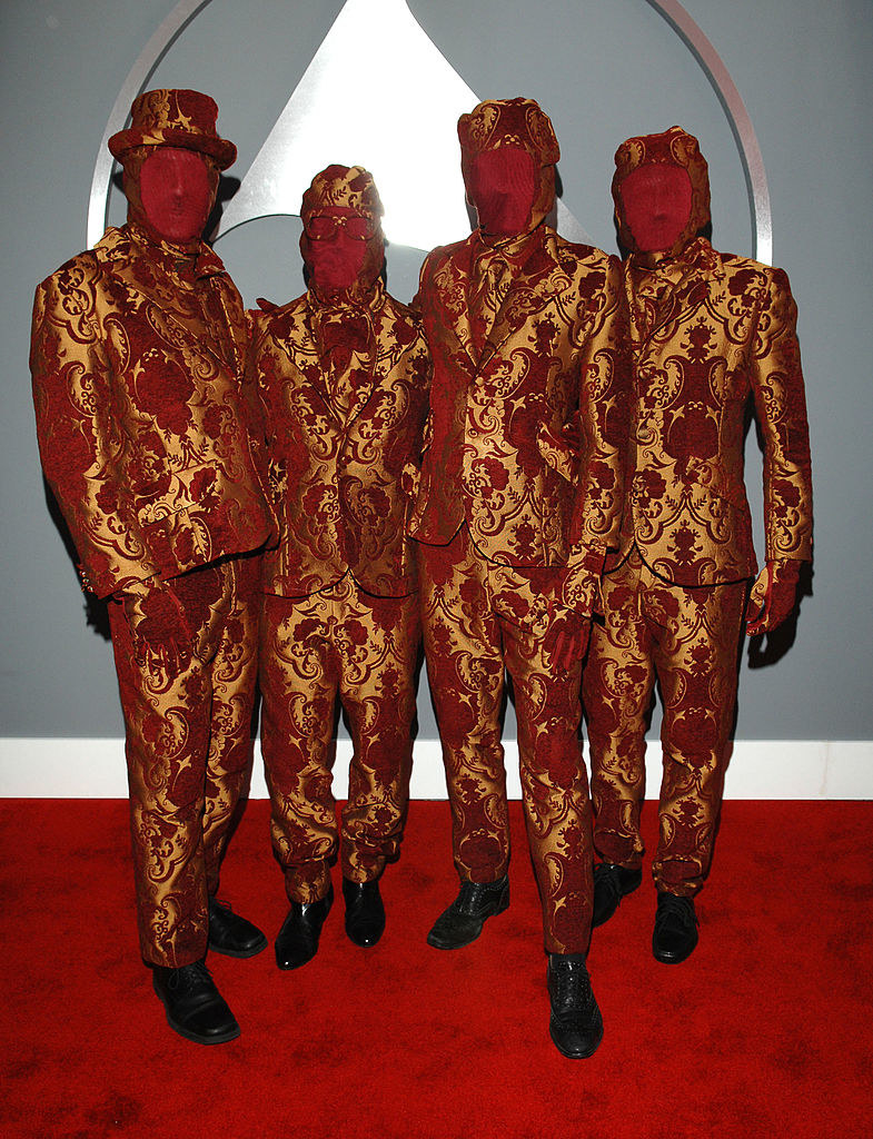 faces covered in fabric the same color as the carpet and matching metallic suits