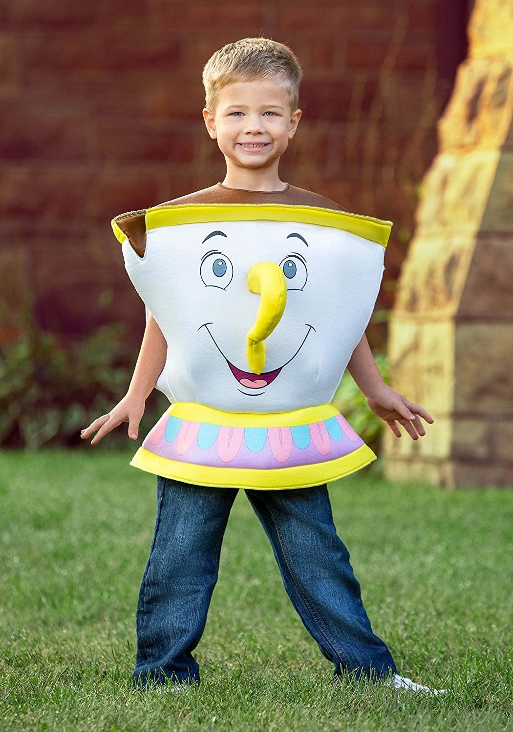 a child wearing a costume that looks like chip the teacup from beauty and the beast