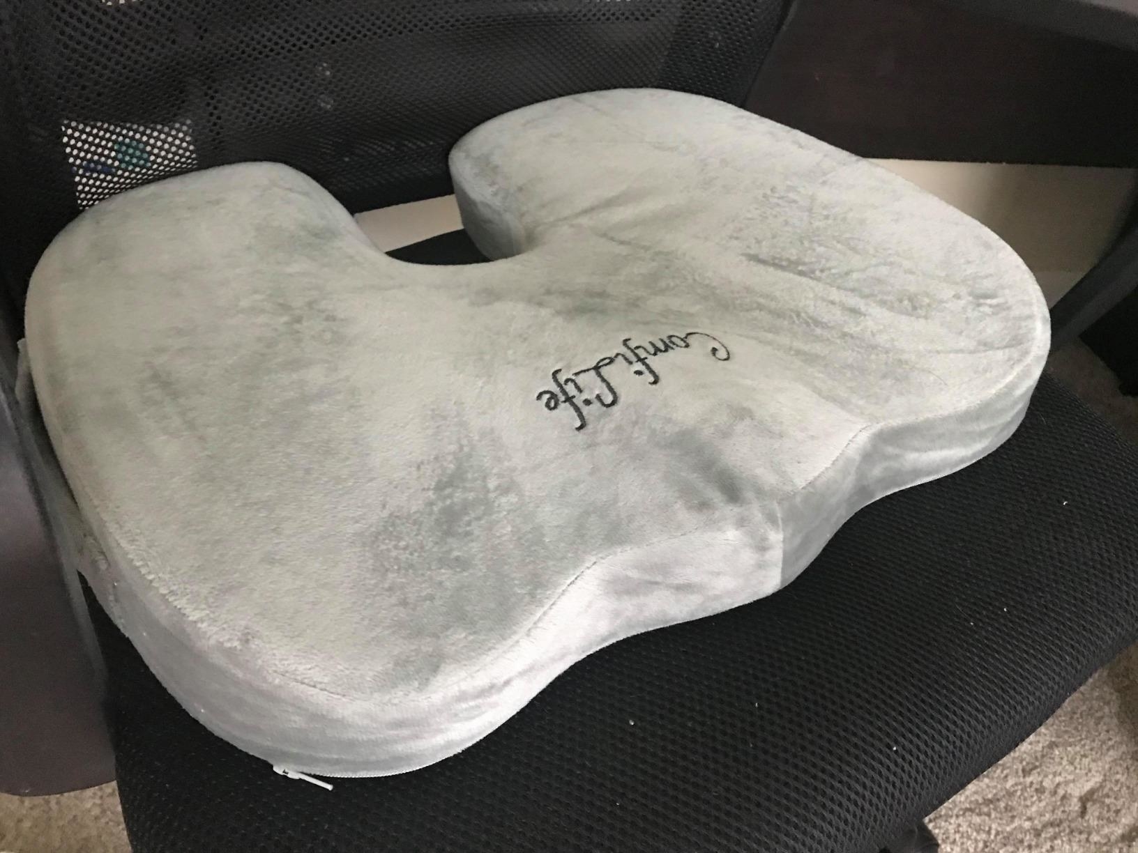 the gray seat cushion on a chair
