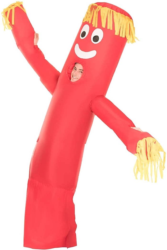 a model wearing the red wacky arm guy suit
