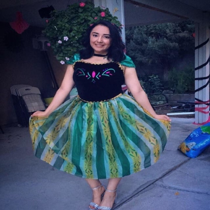 a reviewer curtsying in the dress