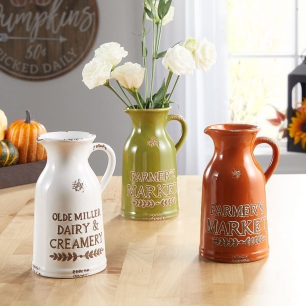 The set of three ceramic jugs.