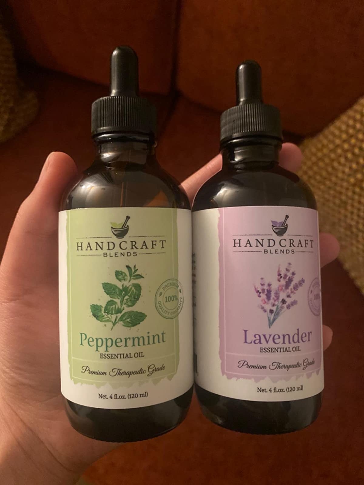 reviewer holding the peppermint and lavender oils