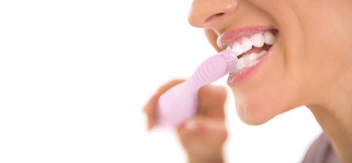 Woman brushing teeth