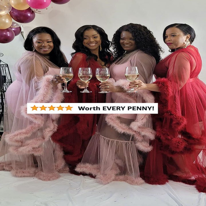 Reviewer image of four people in the pink and red robes