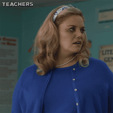 Stressed teacher saying &quot;oh my god&quot; and touching her head
