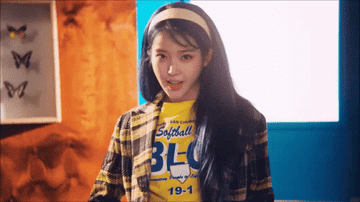 IU sings to her song &quot;Blueming&quot; in its music video