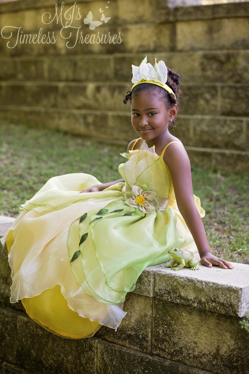 a model in a green ballgown like tiana&#x27;s
