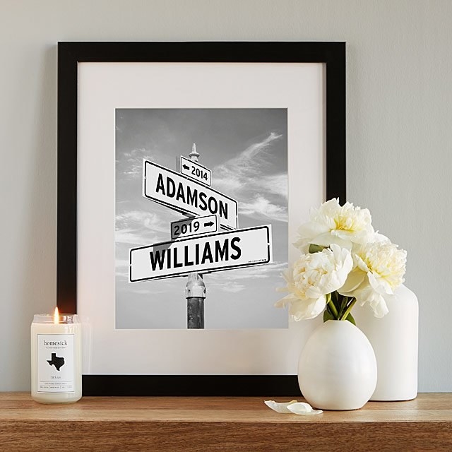 Product image of a framed black and white print of four street signs connected with top saying &quot;2014&quot;, the next two reading &quot;Adamson&quot; and &quot;2019&quot;, and the bottom one saying &quot;Williams&quot;